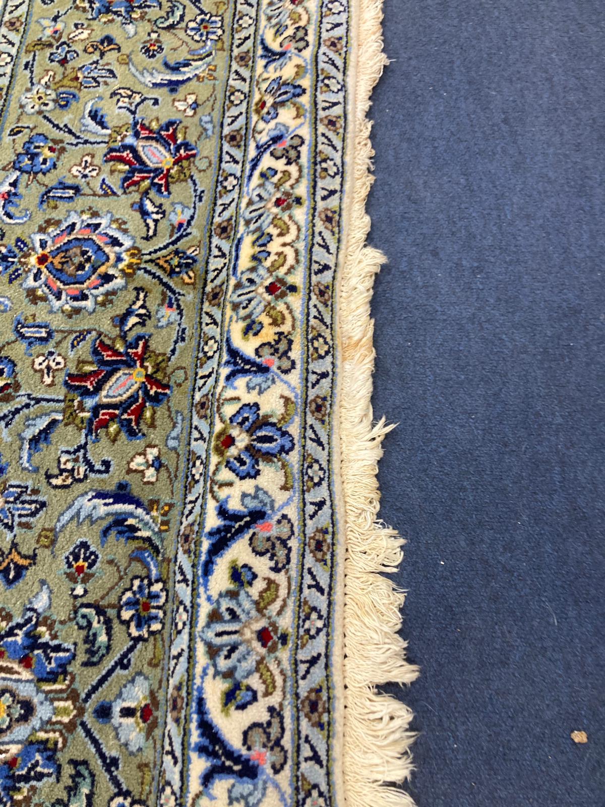 A North West Persian ivory ground carpet, 350 x 250cm